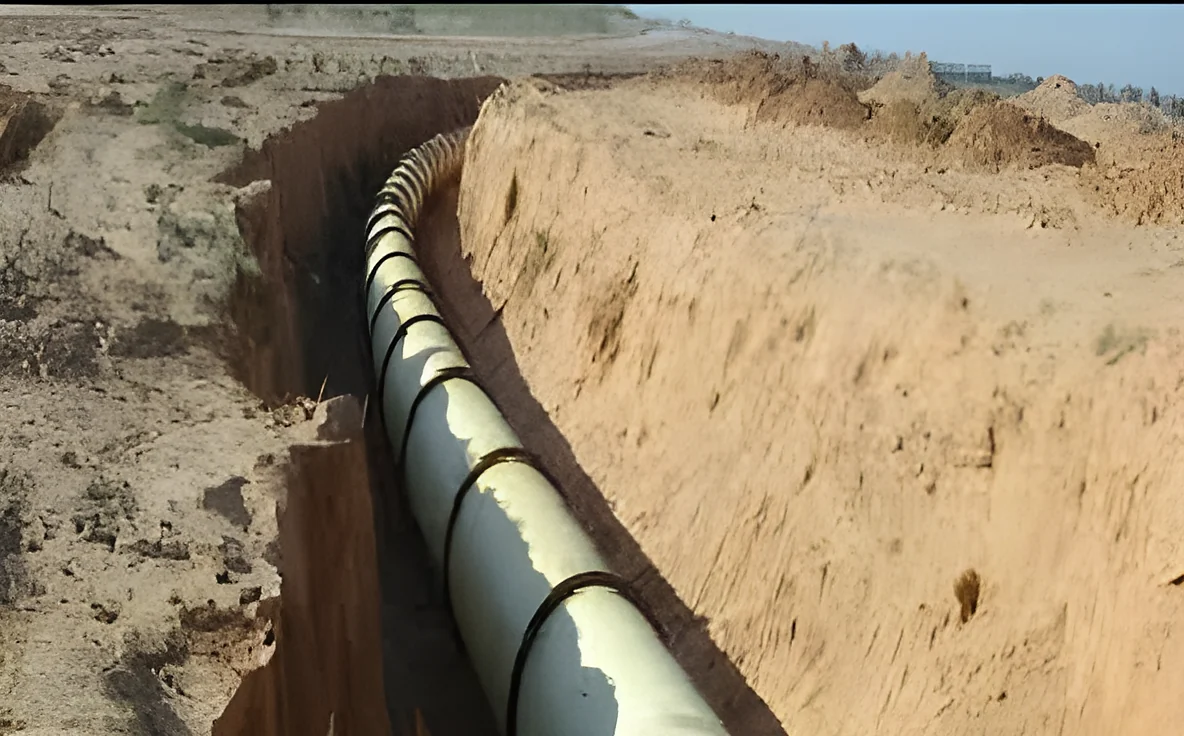 Ductile iron main bedded along a sand trench